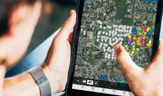 Person using sales mapping by SalesRabbit on a tablet