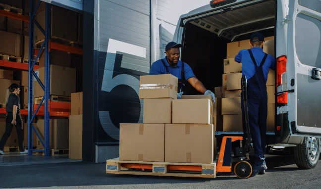 two men unloading shipment of boxes